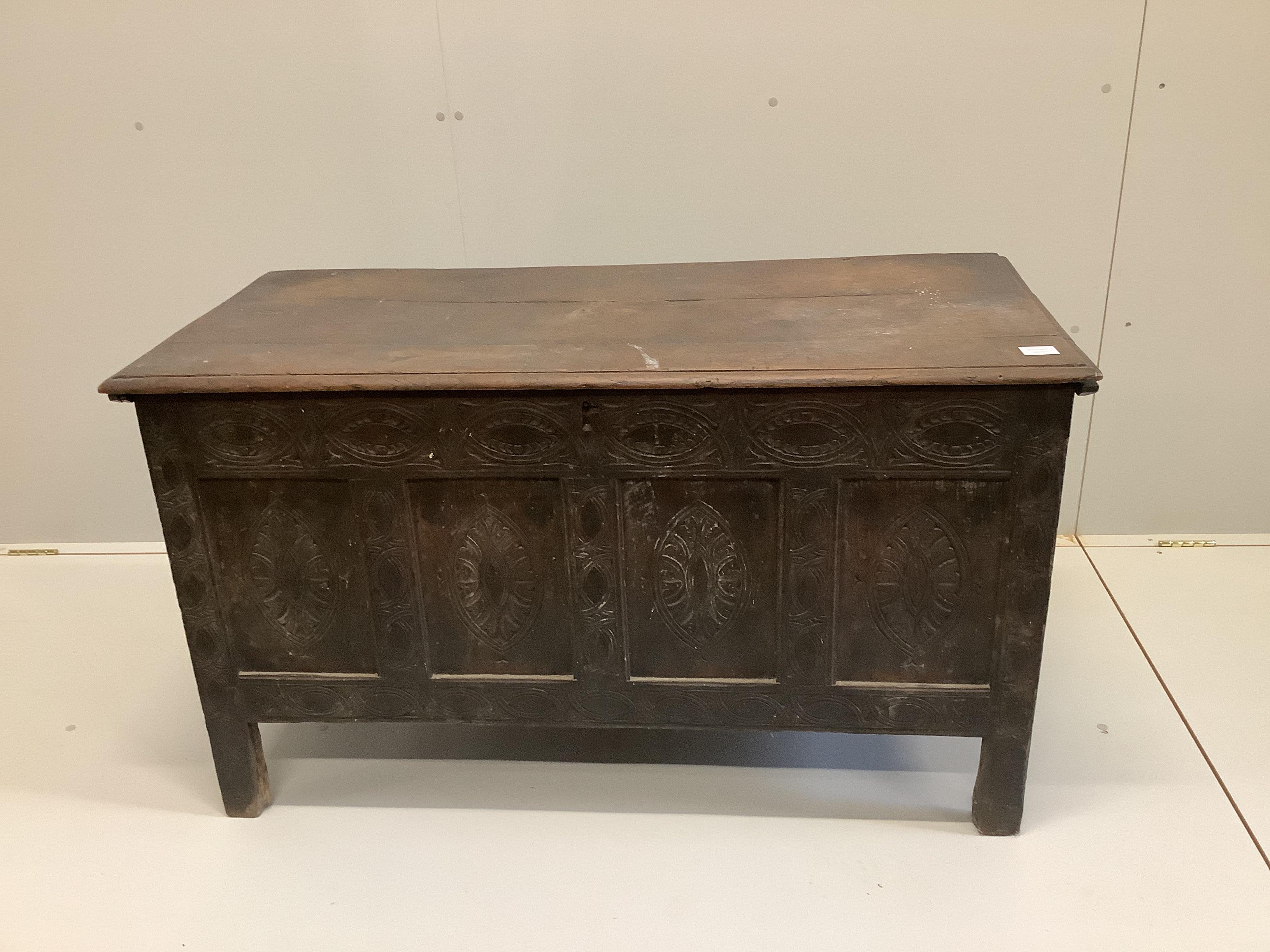 A 17th / 18th century West Country panelled oak coffer, width 122cm, depth 55cm, height 71cm